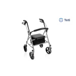 Rollator pieghevole TETI in acciaio verniciato colore argento. 4 ruote PU Ø 20 cm, freno stazionamento, maniglie regolabili 80-90 cm. Seduta imbottita, schienale ribaltabile, busta portaoggetti. Portata 136 kg, peso 9 kg.